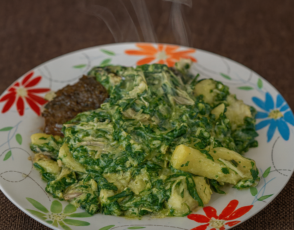Cocoyam porridge cooked with snail, served with liver.